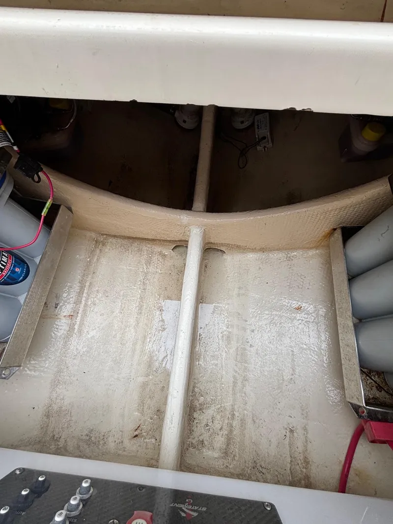 Slide: The Image of 2013 Statement 35 Center Console boat interior with visible wiring and storage compartments. - 20