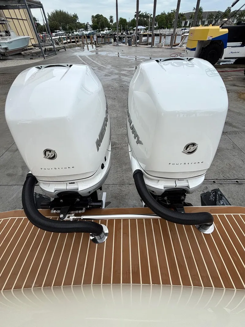 Slide: The Image of Twin Mercury FourStroke engines on a 2013 Statement 35 Center Console boat. - 24