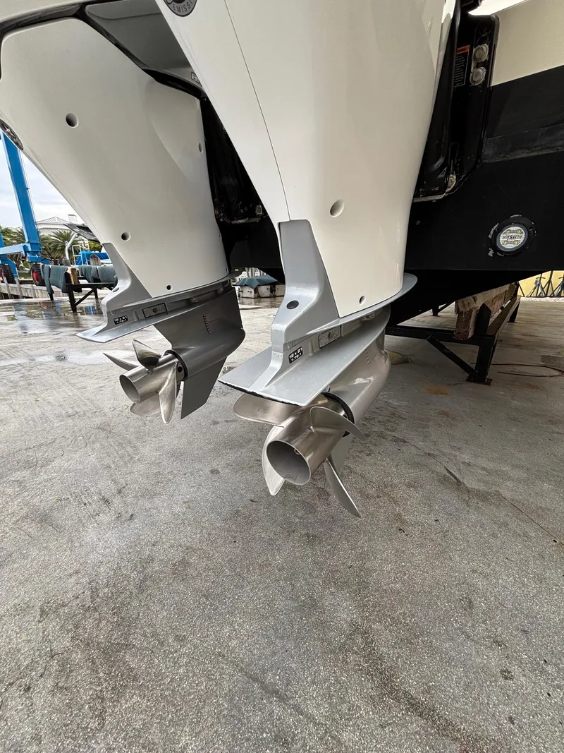 Slide: The Image of Twin outboard motors on a 2013 Statement 35 Center Console boat. - 30