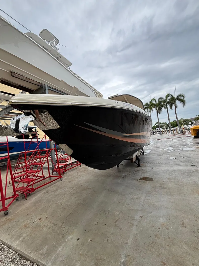 Slide: The Image of 2013 Statement 35 Center Console boat on dry dock with overcast sky. - 5