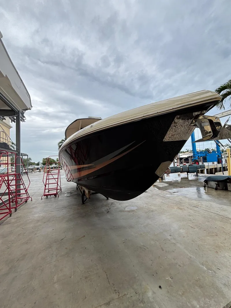 Slide: The Image of 2013 Statement 35 Center Console boat on dry dock under cloudy sky. - 6