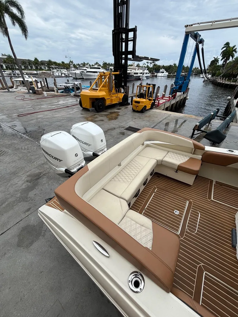 Slide: The Image of 2013 Statement 35 Center Console boat with Mercury engines at a marina dock. - 7