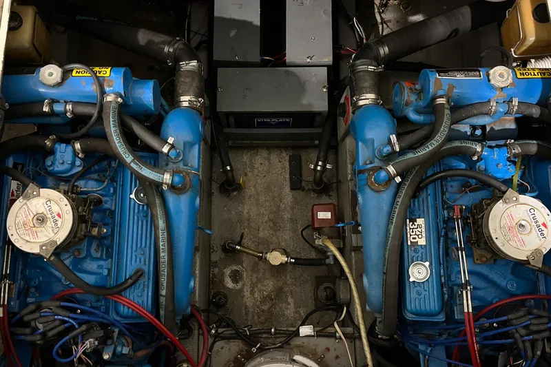Slide: The Image of Engine room of a 1987 Tollycraft 30 Sport Cruiser with dual blue engines. - 19
