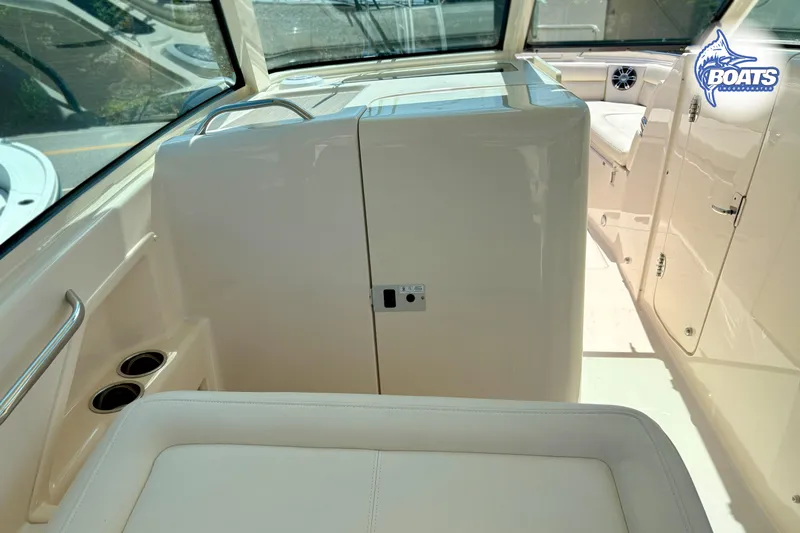 Slide: The Image of 2025 Grady-White Freedom 325 boat interior with seating and storage compartments. - 10
