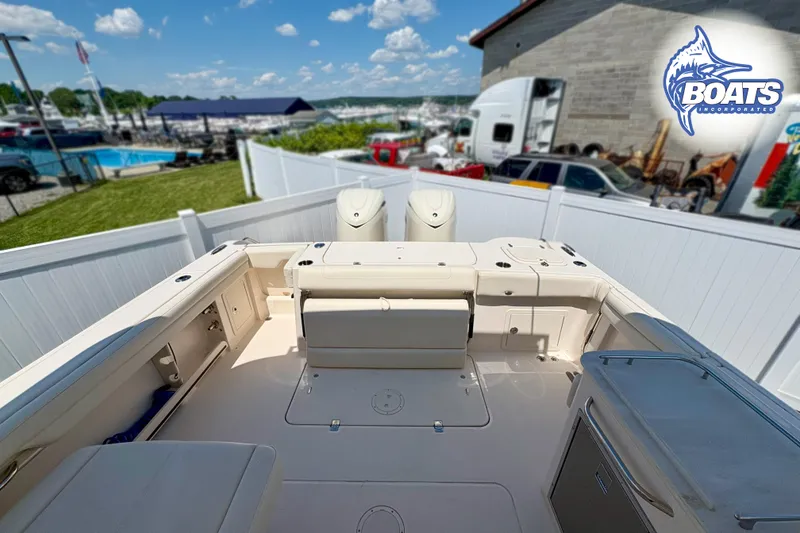 Slide: The Image of 2025 Grady-White Freedom 325 boat interior, featuring spacious seating and modern amenities. - 16