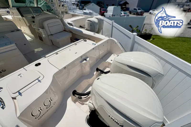 Slide: The Image of 2025 Grady-White Freedom 325 boat with dual Yamaha engines, interior view. - 19