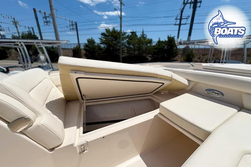 Slide: The Image of 2025 Grady-White Freedom 325 boat interior with open storage compartment. - 5