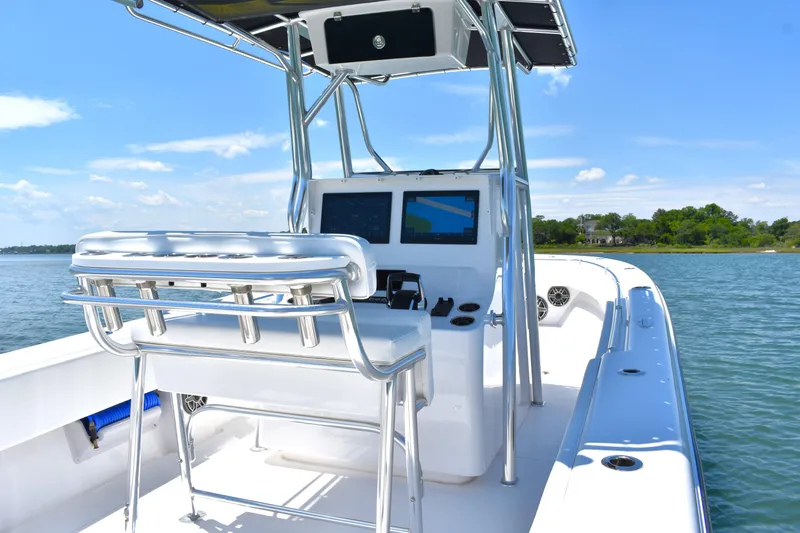 Slide: The Image of 2024 Contender 28 Tournament boat on water, featuring sleek design and modern navigation equipment. - 16