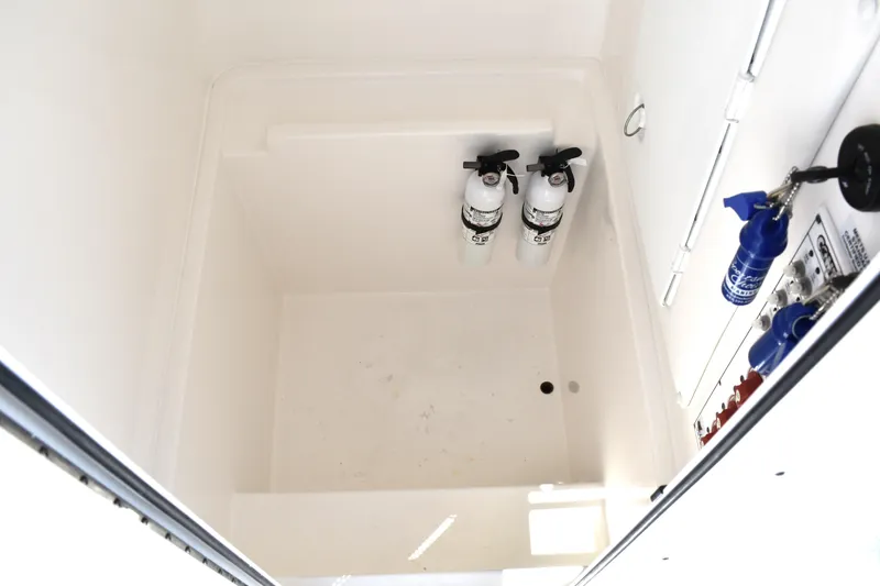 Slide: The Image of 2024 Contender 28 Tournament storage compartment with fire extinguishers and equipment. - 22