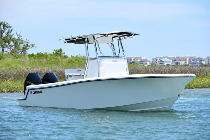 Slide: The Image of 2024 Contender 28 Tournament boat on water, featuring dual engines and sleek design. - 6