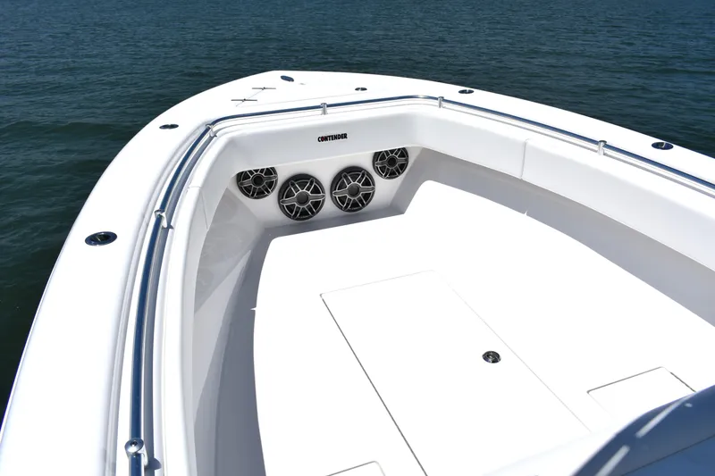 Slide: The Image of 2024 Contender 28 Tournament boat bow with speakers, sleek design, and ocean backdrop. - 9