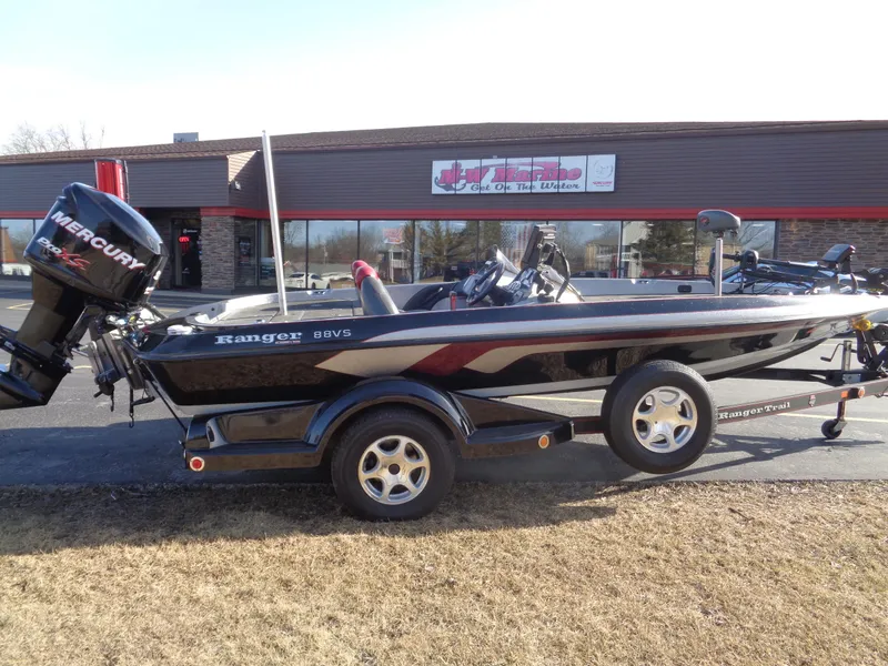 Slide: The Image of 2007 Ranger 188DVS boat with Mercury engine parked outside a building. - 12