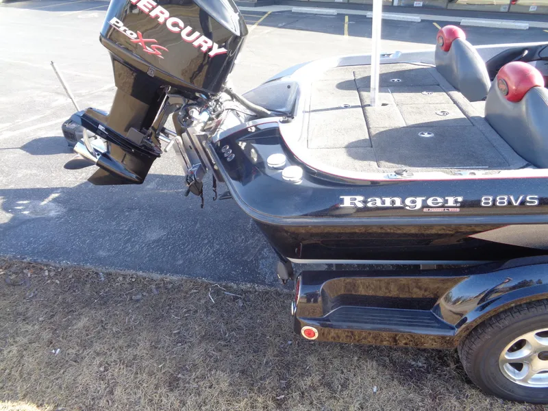 Slide: The Image of 2007 Ranger 188DVS boat with Mercury motor, parked on pavement. - 13