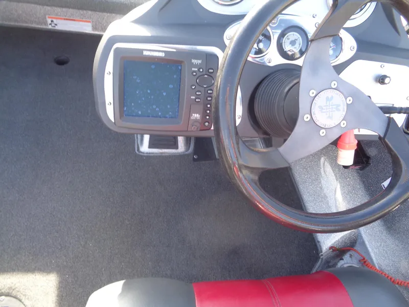 Slide: The Image of 2007 Ranger 188DVS boat dashboard with steering wheel and fish finder display. - 16