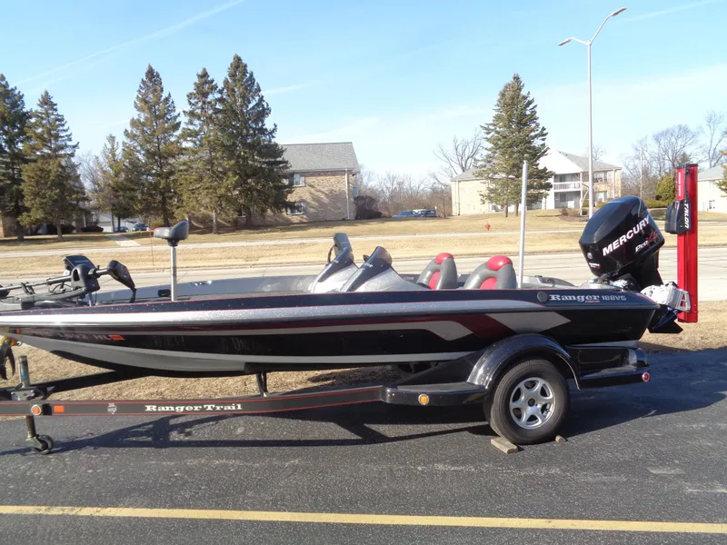 Slide: The Image of 2007 Ranger 188DVS boat on trailer, parked outdoors, with Mercury outboard motor. - 2