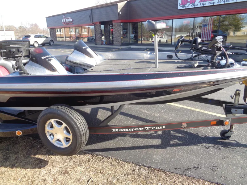 Slide: The Image of 2007 Ranger 188DVS boat on trailer, parked outside a store. - 21