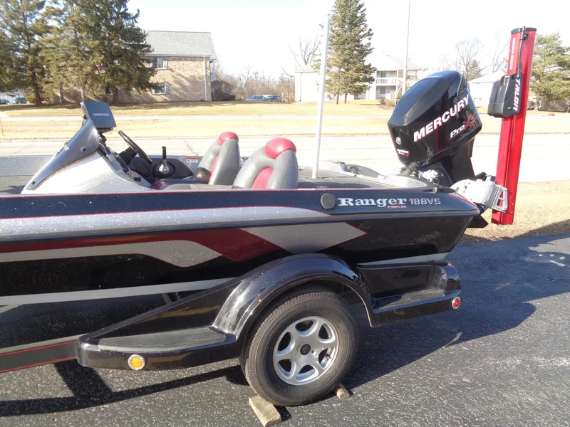 Slide: The Image of 2007 Ranger 188DVS boat with Mercury engine, parked on a sunny day. - 3