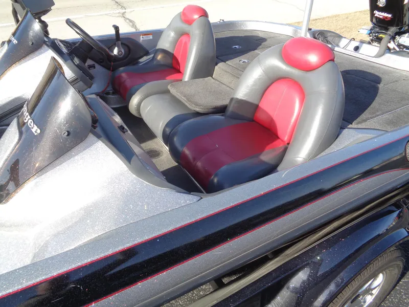 Slide: The Image of 2007 Ranger 188DVS boat interior with red and gray seats, steering wheel visible. - 4