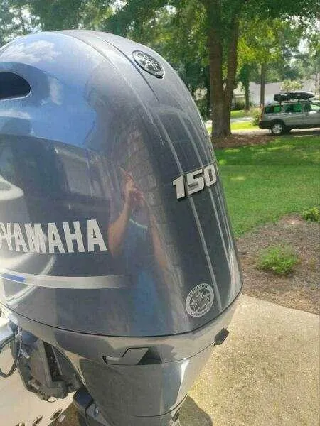 Slide: The Image of Yamaha 150 outboard motor on a 2022 NauticStar 2102 Legacy boat. - 11