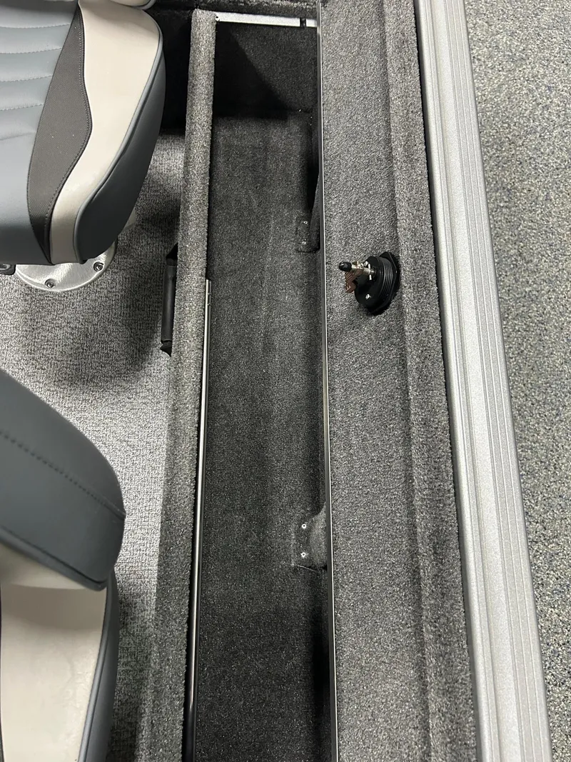 Slide: The Image of 2024 Alumacraft Classic 165 Sport interior with gray seating and storage compartment. - 11