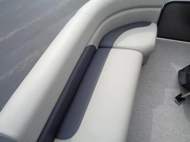 Slide: The Image of 2022 Premier 210 Sunspree pontoon boat on trailer in parking lot. - 16