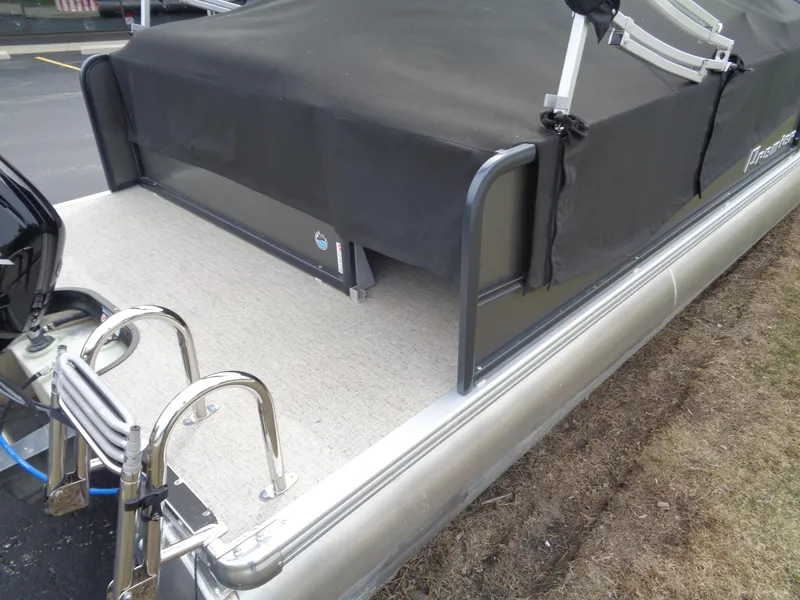 Slide: The Image of 2022 Premier 210 Sunspree pontoon boat with covered deck and stainless steel ladder. - 25