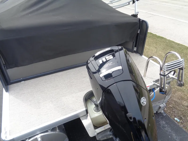 Slide: The Image of 2022 Premier 210 Sunspree boat with Mercury 115 outboard motor, covered deck. - 26