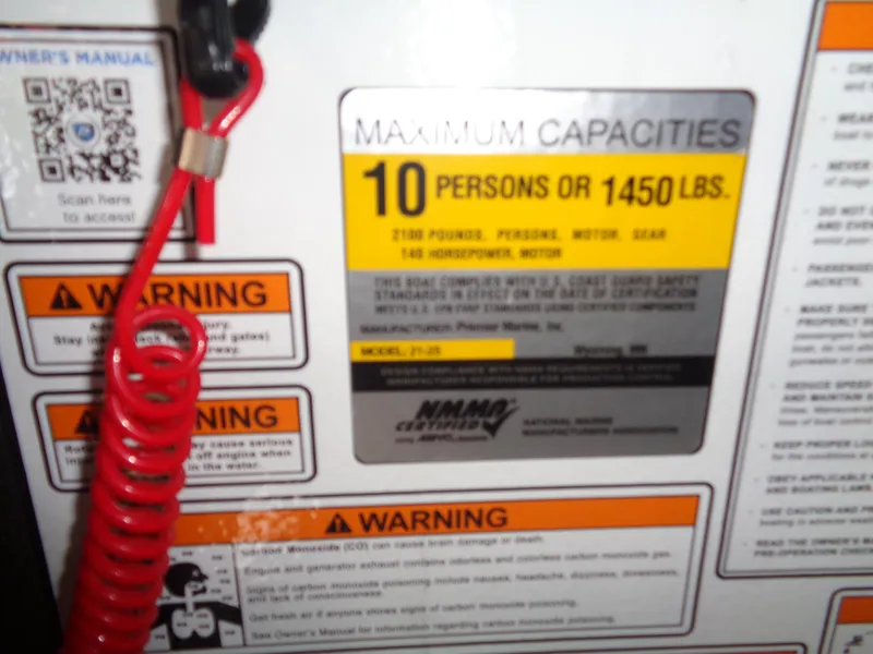 Slide: The Image of Capacity label on 2022 Premier 210 Sunspree, max 10 persons or 1450 lbs, with warnings. - 30