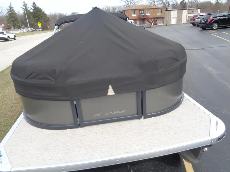 Slide: The Image of 2022 Premier 210 Sunspree boat dashboard with steering wheel and controls. - 4