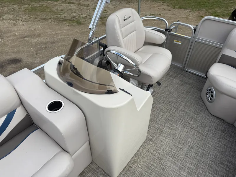 Slide: The Image of 2016 Apex Marine Qwest Adventure 7516 pontoon boat interior with helm and seating. - 15