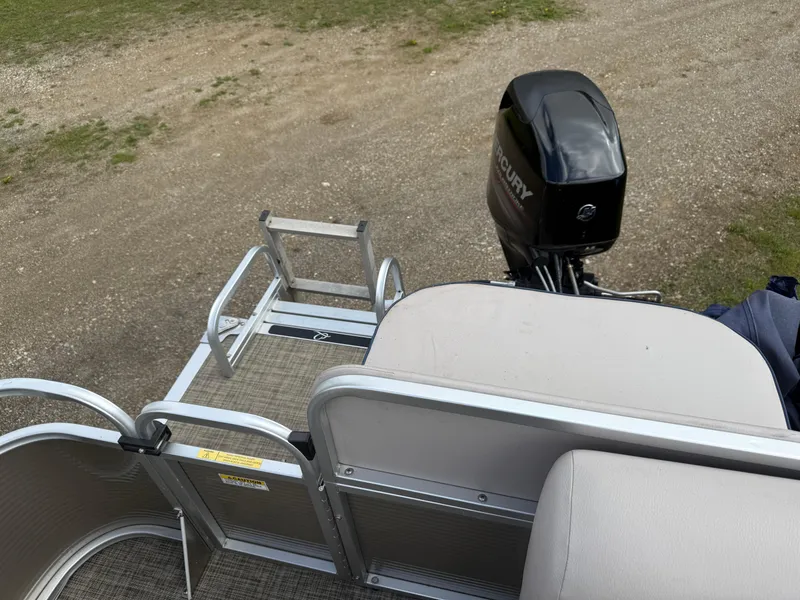 Slide: The Image of 2016 Apex Marine Qwest Adventure 7516 pontoon boat with Mercury outboard motor and ladder. - 19