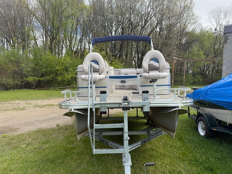 Slide: The Image of 2016 Apex Marine Qwest Adventure 7516 pontoon boat on trailer, parked on grass. - 3