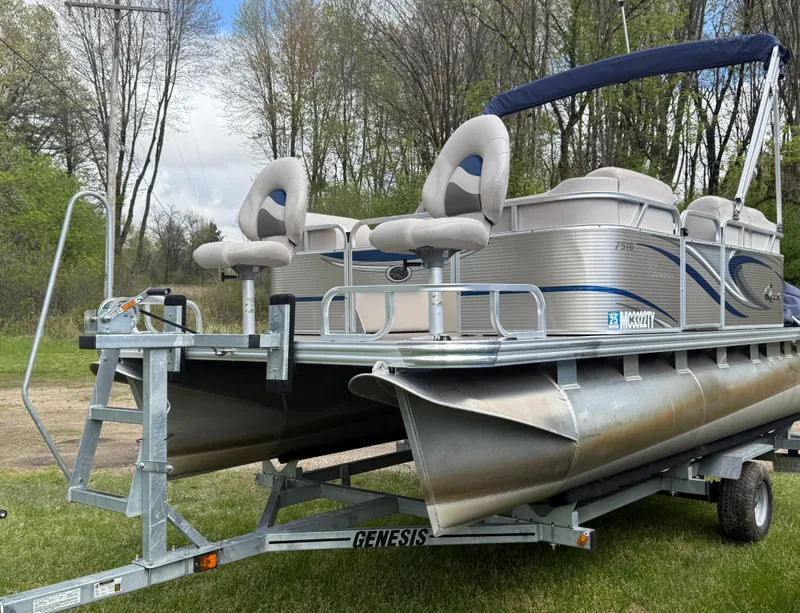 Slide: The Image of 2016 Apex Marine Qwest Adventure 7516 pontoon boat on trailer, parked on grass. - 5