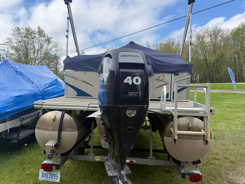 Slide: The Image of 2016 Apex Marine Qwest Adventure 7516 pontoon boat with Mercury 40 HP engine on trailer. - 6