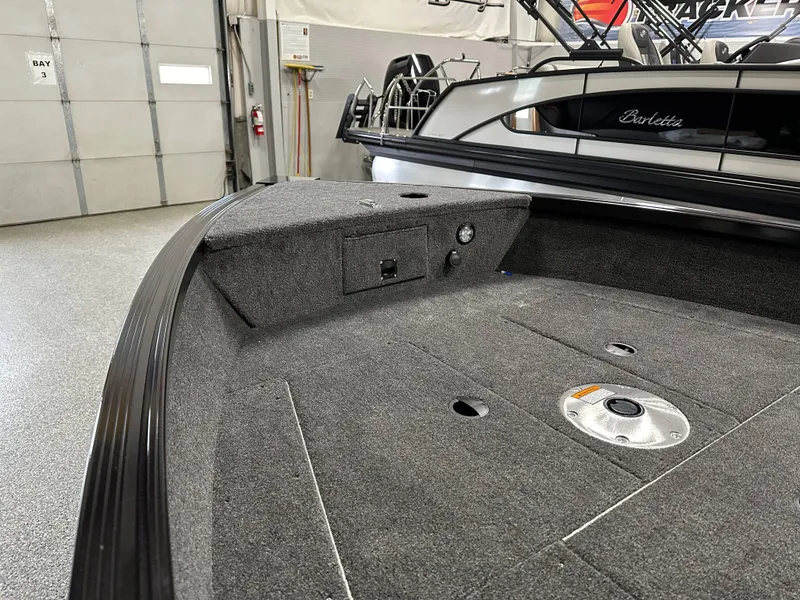 Slide: The Image of 2024 Alumacraft Classic 165 SC boat interior with gray and black seating. - 11