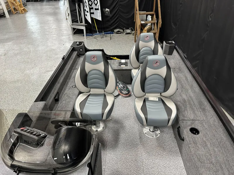 Slide: The Image of Control panel of 2024 Alumacraft Classic 165 SC boat with labeled switches. - 13