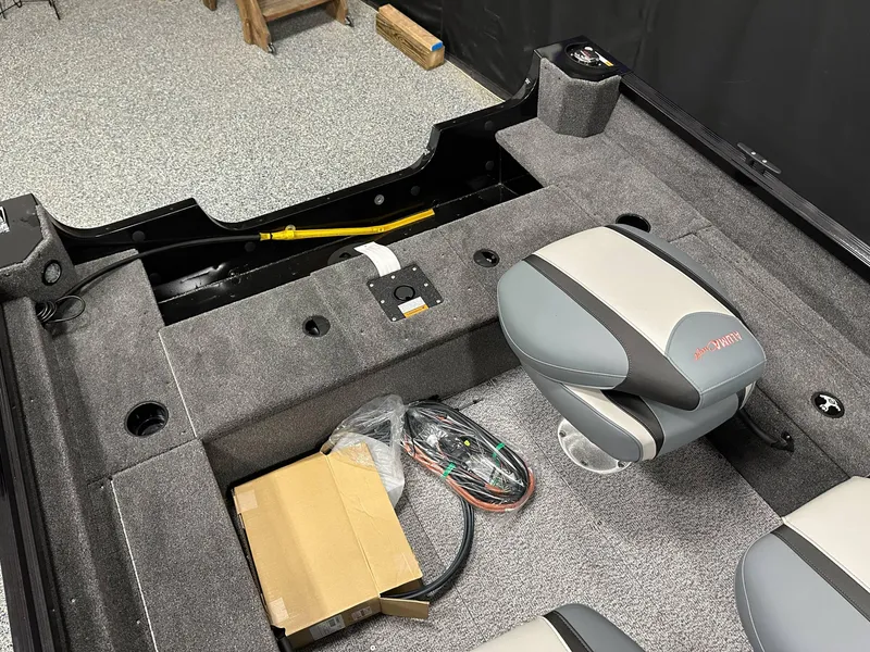 Slide: The Image of 2024 Alumacraft Classic 165 SC boat interior with dual seats and steering console. - 21