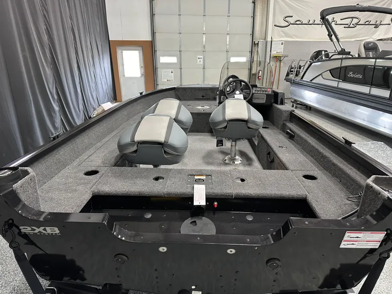 Slide: The Image of 2024 Alumacraft Classic 165 SC boat with visible hull identification number and NMMA certification sticker. - 24