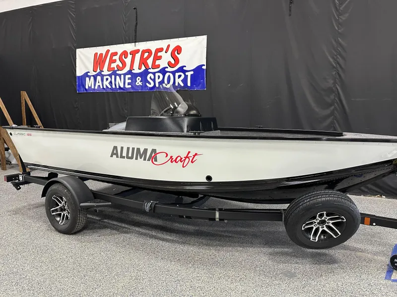 Slide: The Image of 2024 Alumacraft Classic 165 SC boat interior at Westre's Marine & Sport showroom. - 3