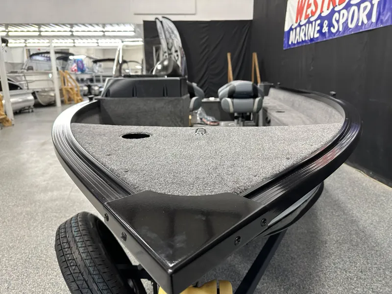 Slide: The Image of 2024 Alumacraft Classic 165 SC boat interior with open storage compartments. - 5