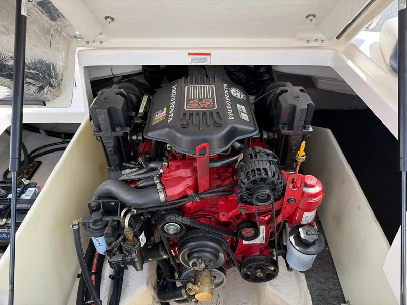 Slide: The Image of Engine compartment of a 2012 Regal 2000 Bowrider boat, featuring a powerful inboard motor. - 16
