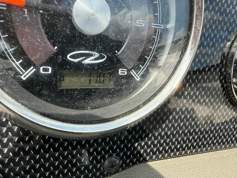 Slide: The Image of Close-up of a 2012 Regal 2000 Bowrider speedometer with carbon fiber dashboard. - 17