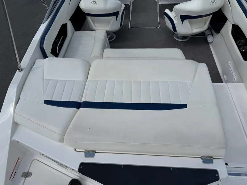 Slide: The Image of 2012 Regal 2000 Bowrider interior with white seating and blue accents. - 8