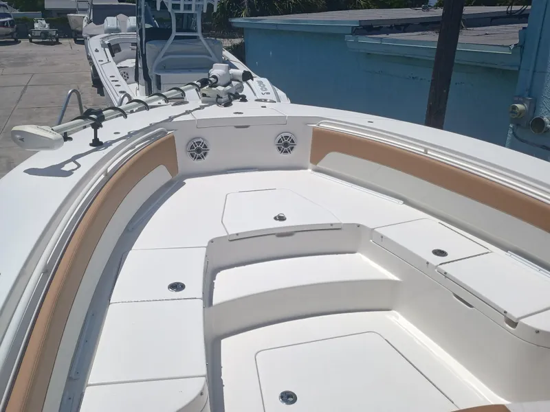 Slide: The Image of 2025 Regulator 30XO boat deck with seating and storage compartments. - 11