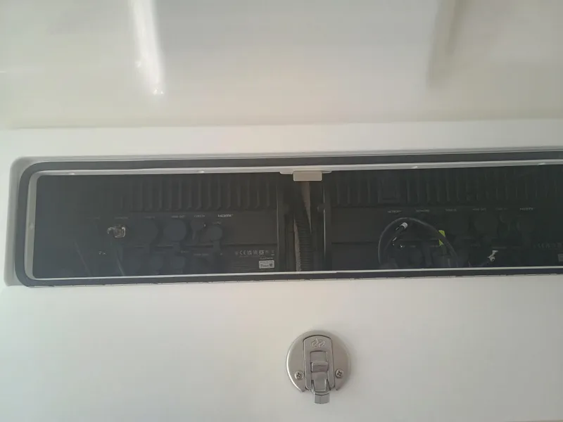 Slide: The Image of Control panel of a 2025 Regulator 30XO boat, featuring various ports and connections. - 15