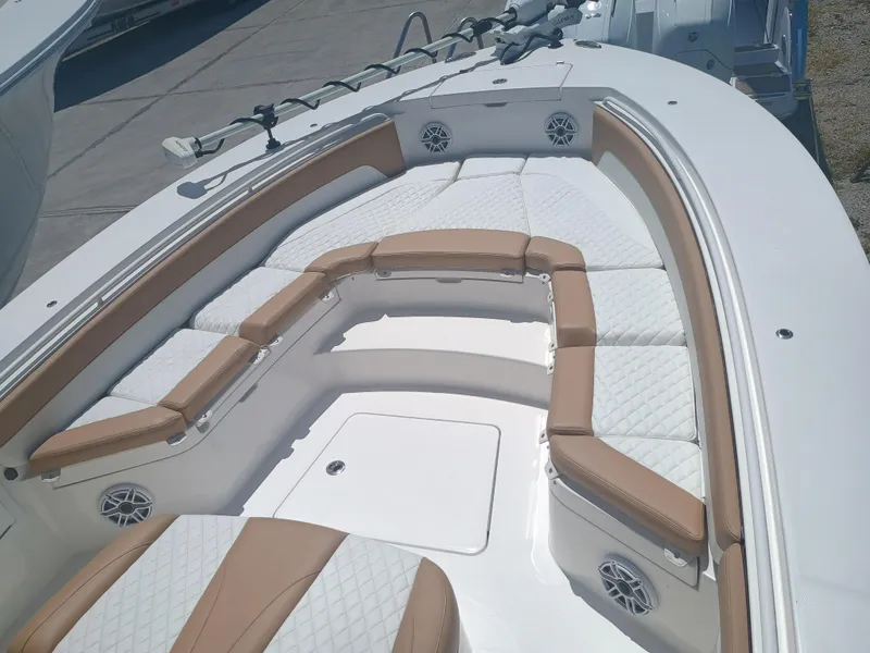 Slide: The Image of 2025 Regulator 30XO boat interior with cushioned seating and modern design. - 5
