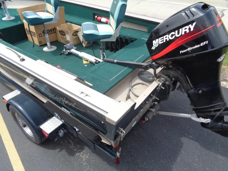 Slide: The Image of 1999 Lund 1650 Angler boat with Mercury FourStroke EFI engine on trailer. - 6