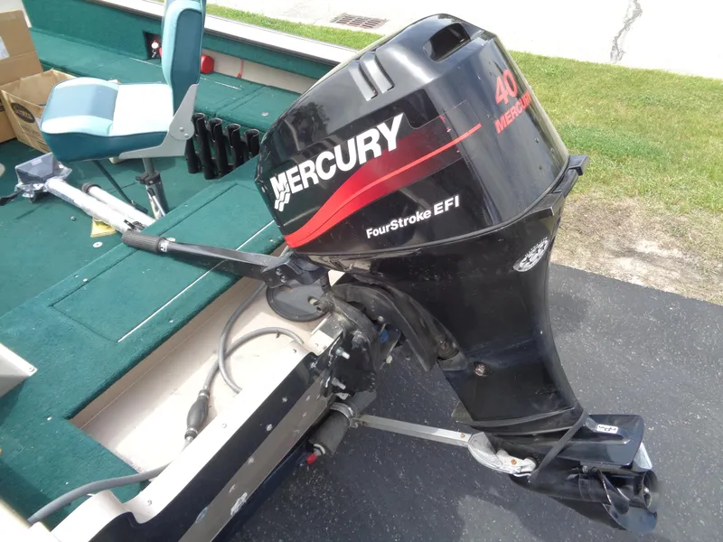 Slide: The Image of 1999 Lund 1650 Angler boat with Mercury FourStroke EFI outboard motor. - 7