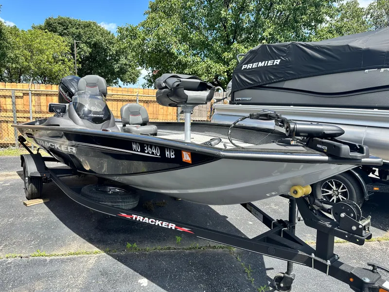 Slide: The Image of 2023 Tracker 175 Pro Team boat on trailer, parked outdoors. - 13