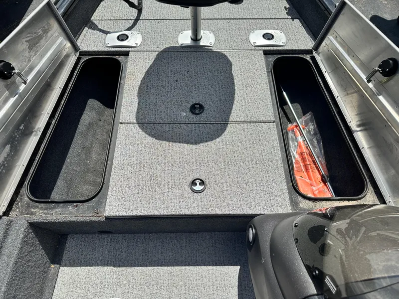 Slide: The Image of 2023 Tracker 175 Pro Team boat interior with storage compartments and seating. - 15
